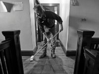 Army veteran and resident Ray Boudreau, chips in by mopping the floors on the third floor at the Veterans Transition House currently housed at the rectory of the now closed St. John church on County Street in New Bedford, MA.  A new building is scheduled tol be constructed in 2019.   PHOTO PETER PEREIRA